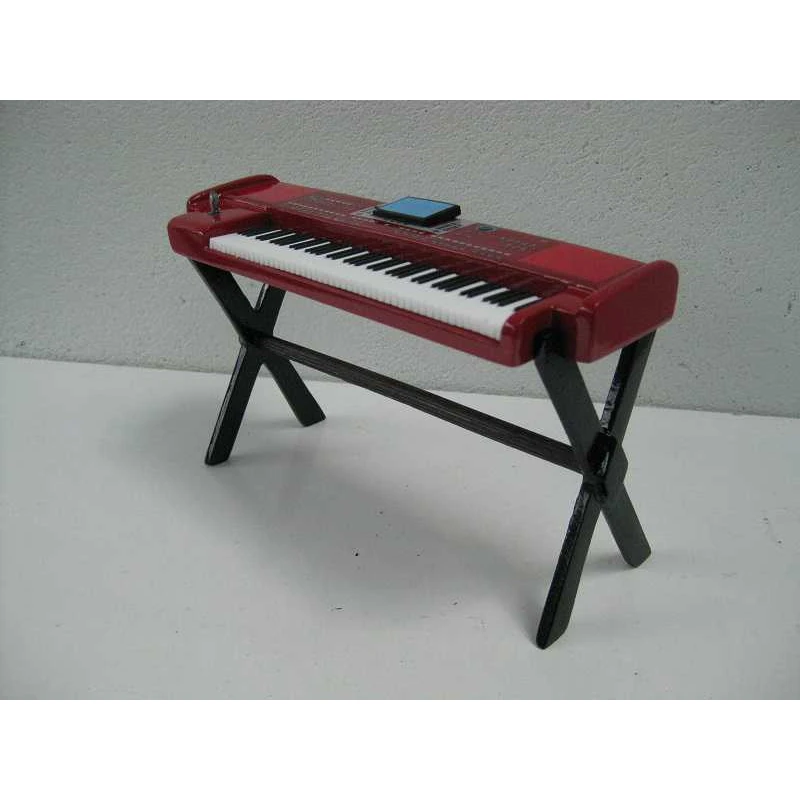 Miniatuur digitaal keyboard (rood) met standaard